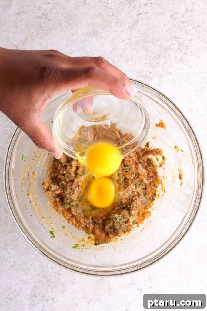 The Meatloaf That Will Turn You Into a Believer 6 adding the egg to the meatloaf mixture
