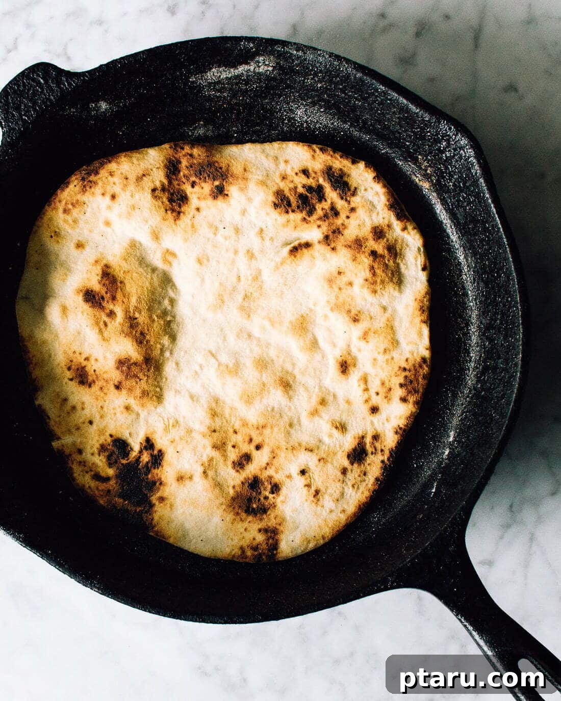 The Only Homemade Pizza Dough Recipe Youll Ever Need 3 Crispy underside of homemade pizza crust cooked in a cast iron skillet