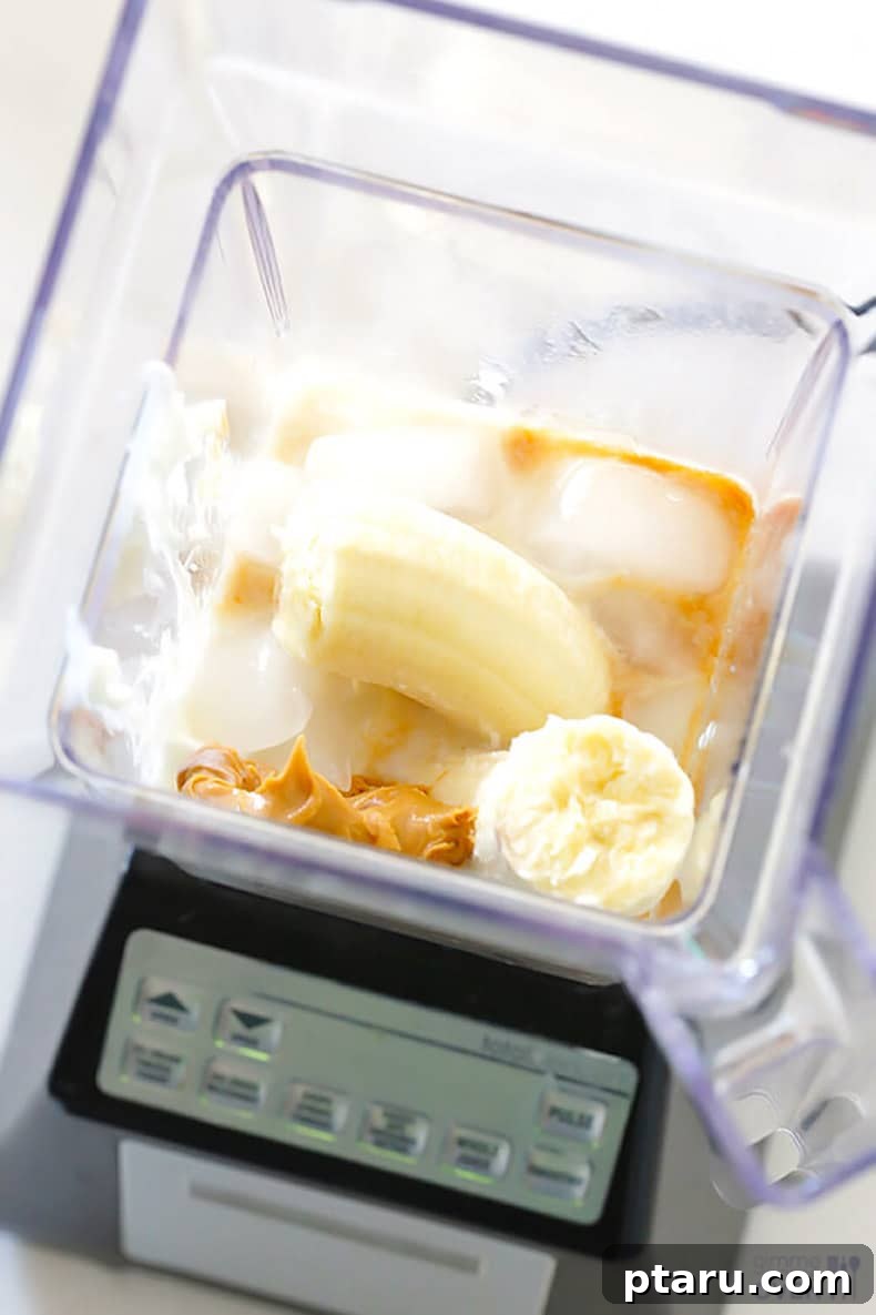 25+ Game-Changing Healthy Smoothie Recipes 14 Creamy peanut butter and ripe bananas ready to be blended, promising a classic and satisfying peanut butter banana smoothie.