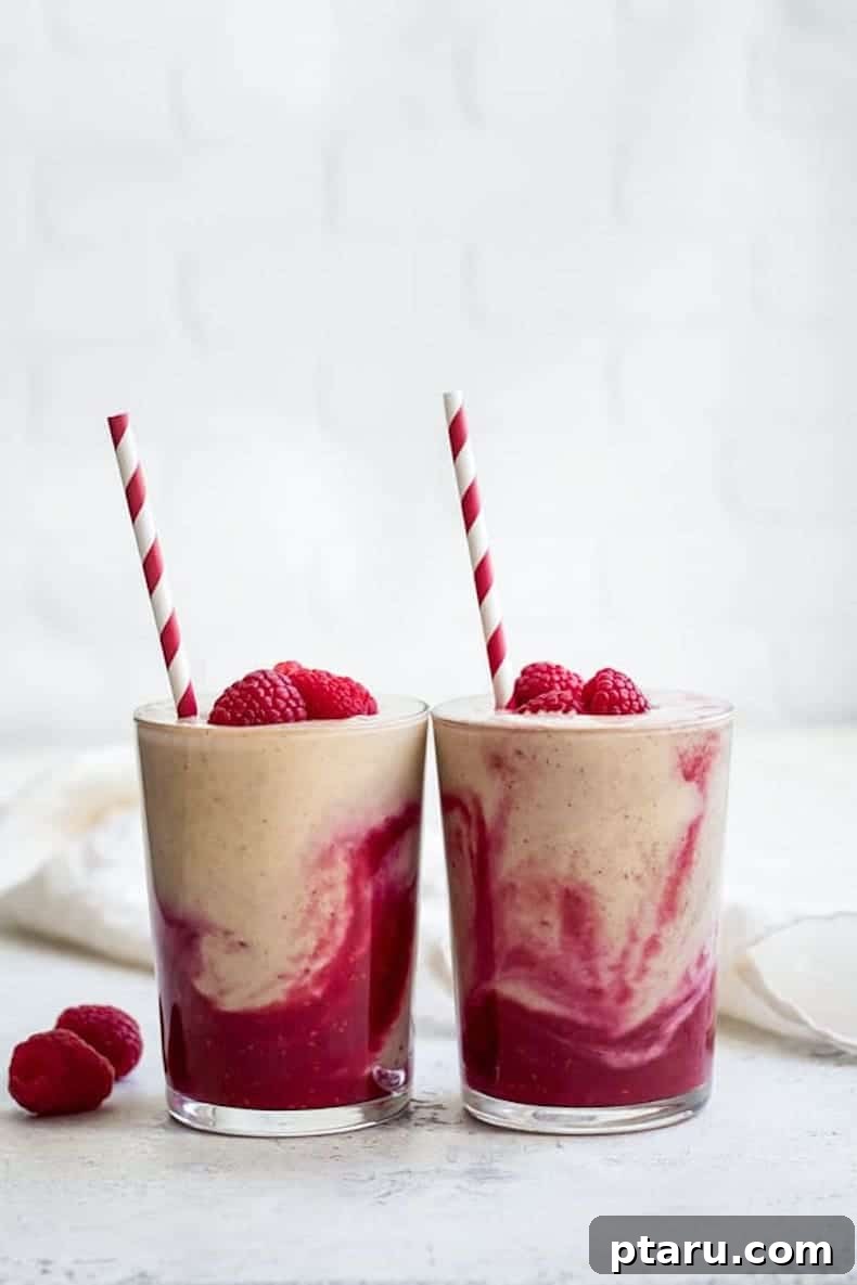 25+ Game-Changing Healthy Smoothie Recipes 16 Overhead view of a vibrant peanut butter and jelly smoothie, beautifully presented and inviting to drink, evoking nostalgic flavors.