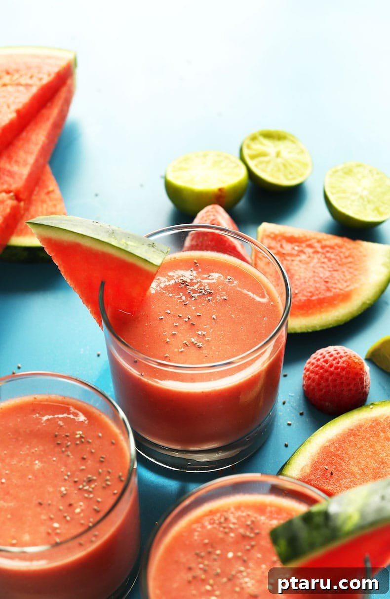 25+ Game-Changing Healthy Smoothie Recipes 10 Slices of refreshing watermelon are displayed next to a glass of strawberry watermelon smoothie, evoking a perfect summer treat.