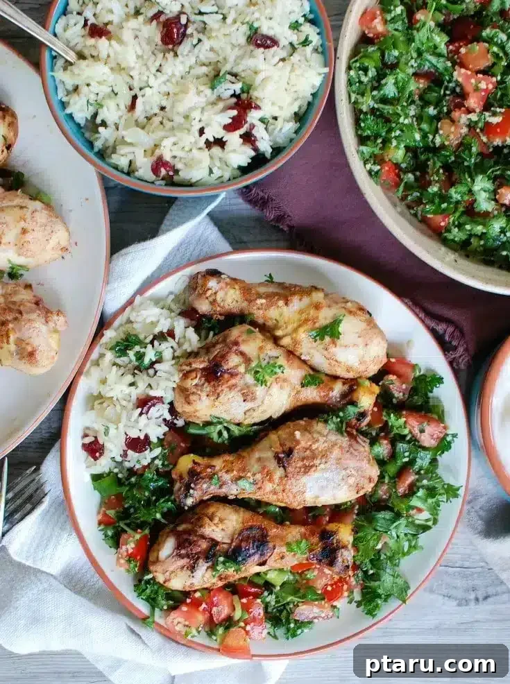 41 Succulent Chicken Drumstick Recipes You Can Make Effortlessly 38 Mediterranean Chicken Drumsticks served with flavorful rice and a fresh salad.