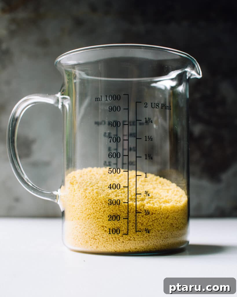 Bright Lemon Couscous Salad 4 dry couscous in a measuring cup.