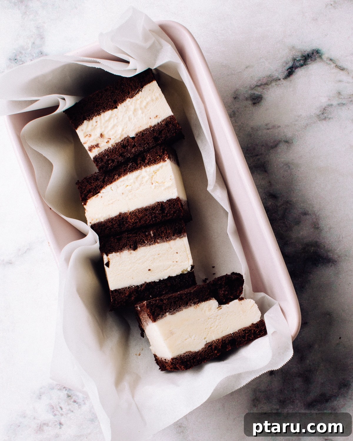 DIY Ice Cream Sandwich Wafers 5 Four homemade ice cream sandwiches neatly arranged in a pink tray