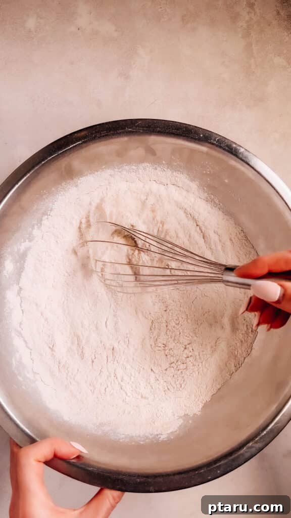 Effortless Velvety Pumpkin Cupcakes 5 Flour in a bowl.