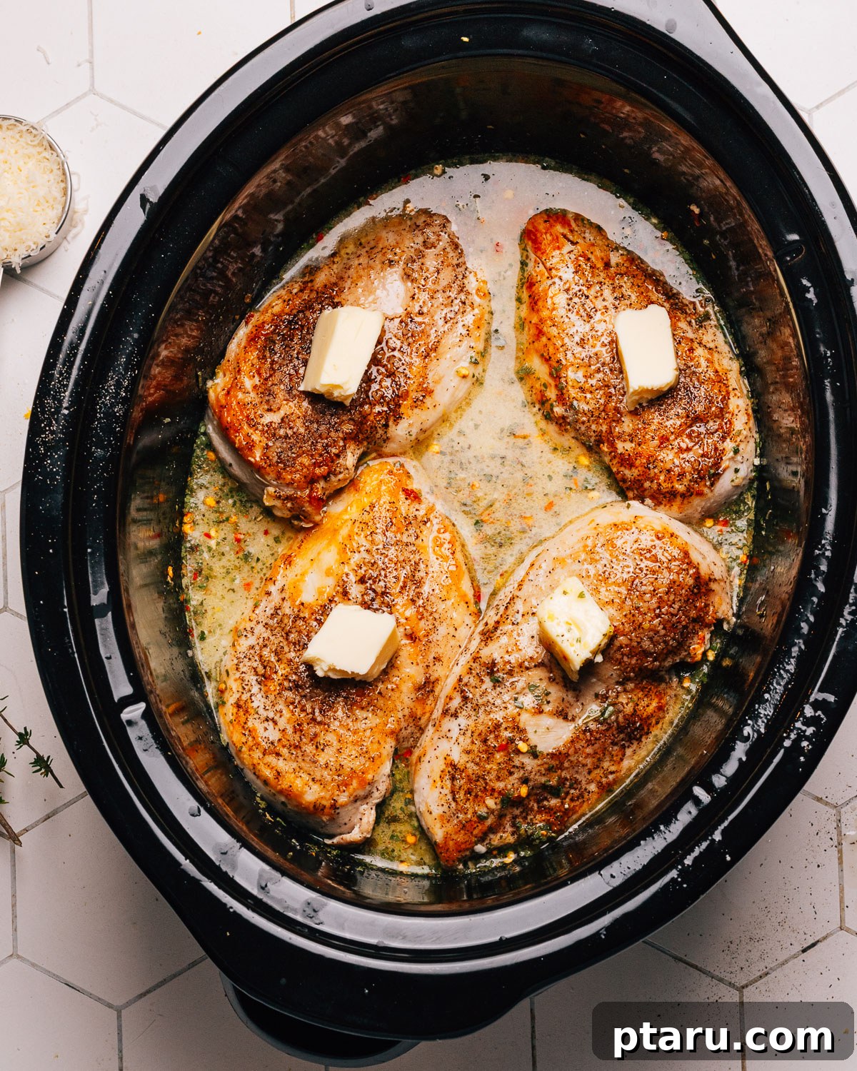 Zesty Slow Cooker Lemon Chicken 5 Whisking the broth and lemon mixture in the crockpot.