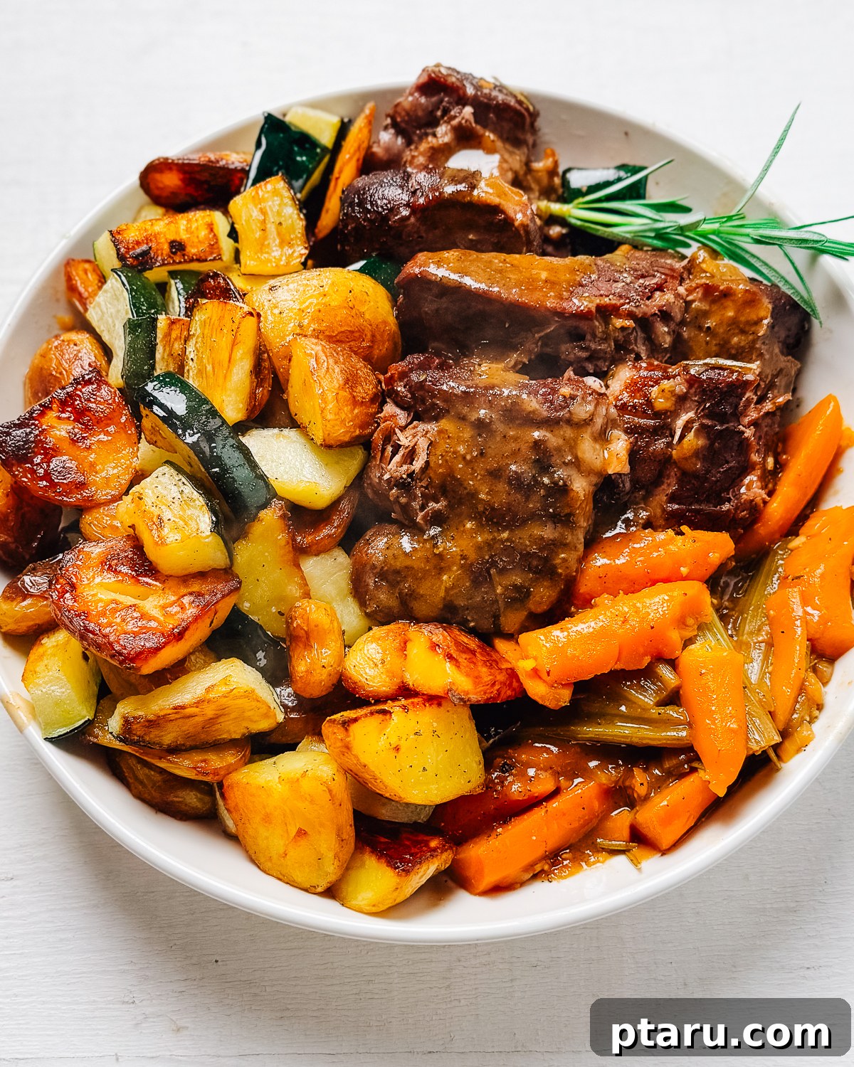 Fifteen Flavors Defining 2025 13 A succulent Beef Chuck Roast served on a platter with roasted potatoes and vegetables.