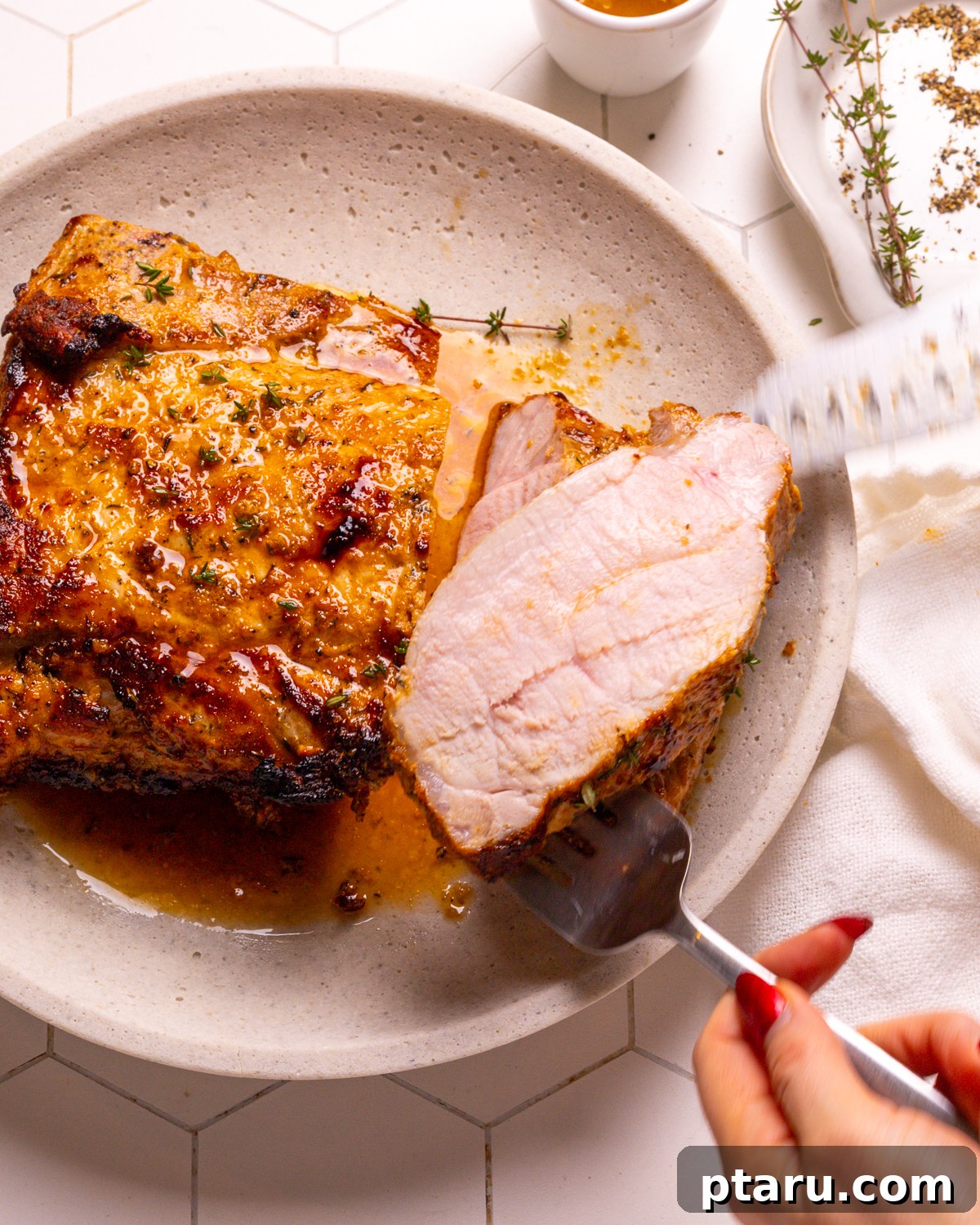 Fifteen Flavors Defining 2025 5 A perfectly cooked Roast Pork Loin, sliced and ready to serve.