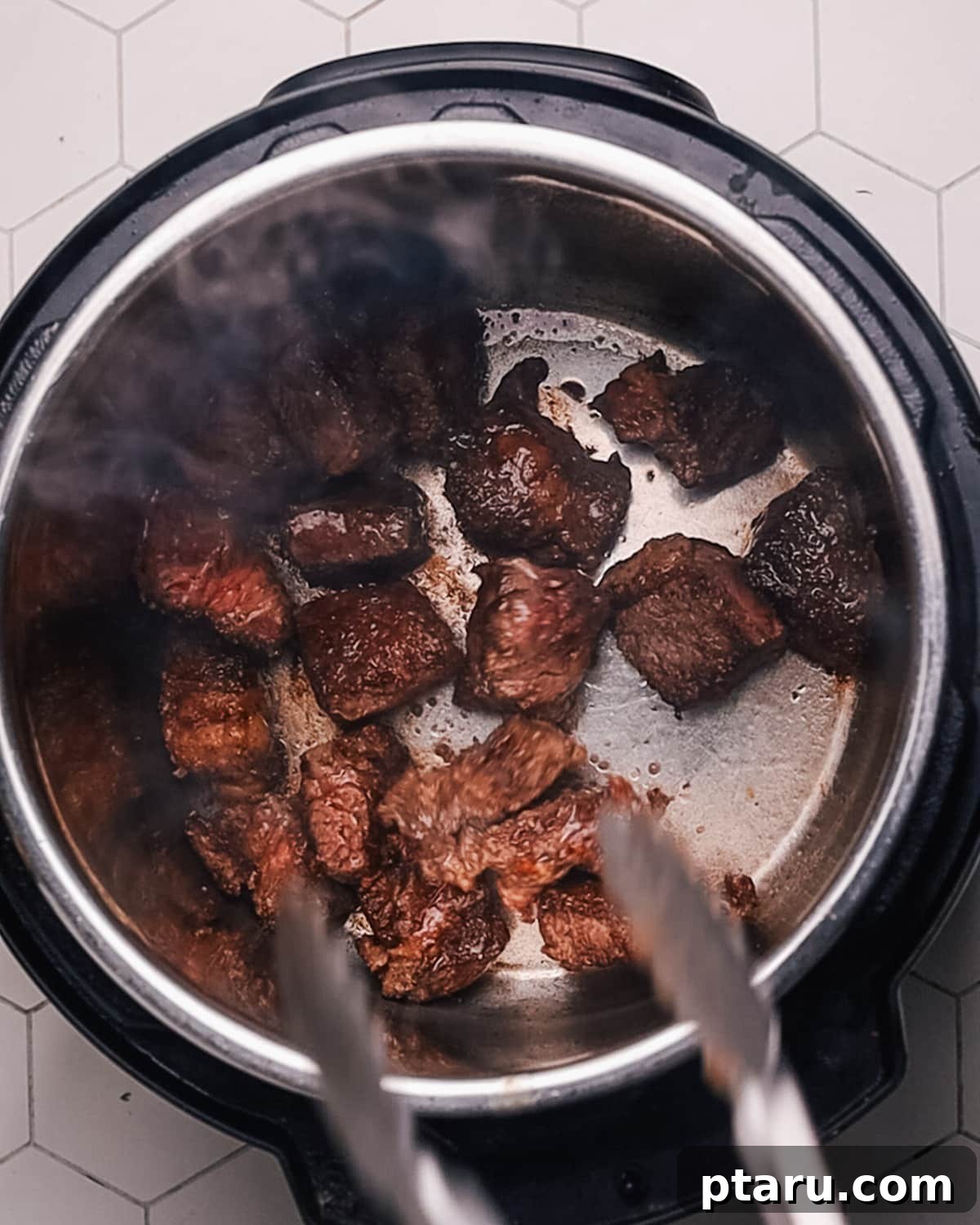 Quick Comfort Beef Stew 4 Step 1: Browning beef stew meat in a pressure cooker to create a rich, savory crust for foundational flavor.