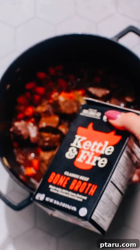 Quick Comfort Beef Stew 5 Step 2: Sautéing finely chopped onions and carrots in the pressure cooker to build an aromatic base after the beef has been removed.