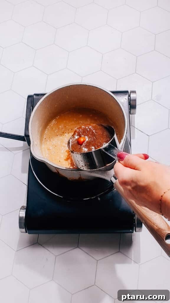 Quick Comfort Beef Stew 7 Step 4: Adding the beef broth and other liquid ingredients to the pressure cooker, along with the browned beef and sautéed vegetables, before sealing for pressure cooking.