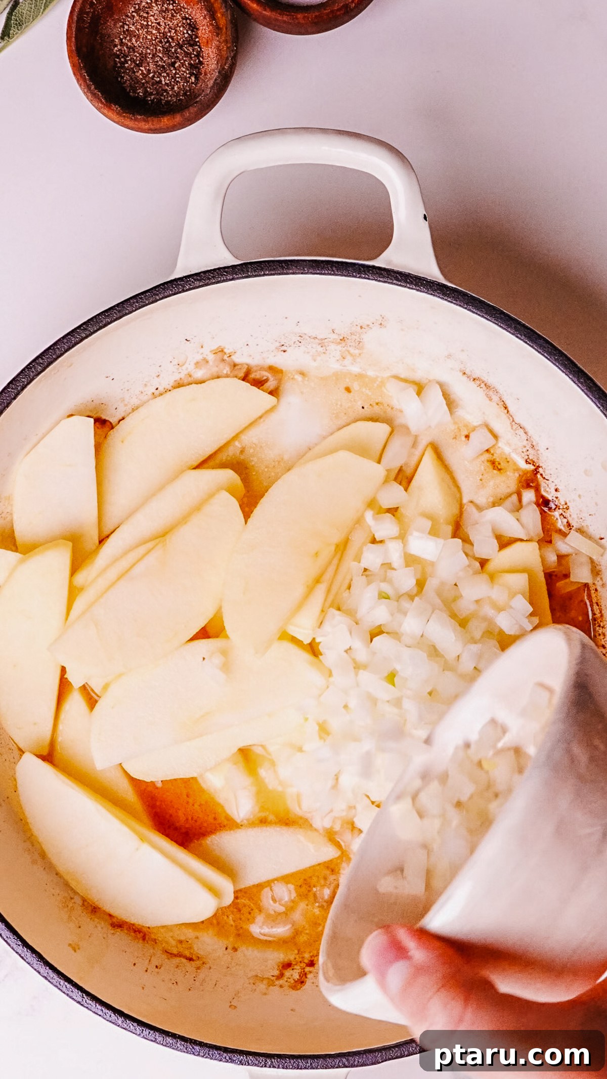 Caramelized Apple Pork Chops with Savory Sauce 6 Step 3: Sauté sliced apples and chopped onions in butter.