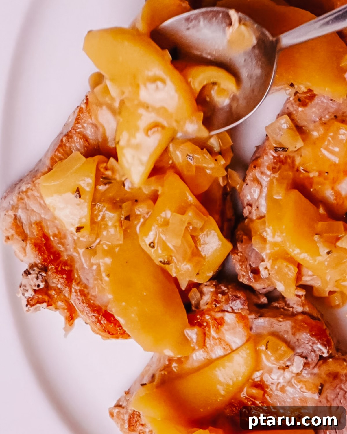Caramelized Apple Pork Chops with Savory Sauce 9 Step 6: Return pork chops to the pan, simmer, and finish with butter.