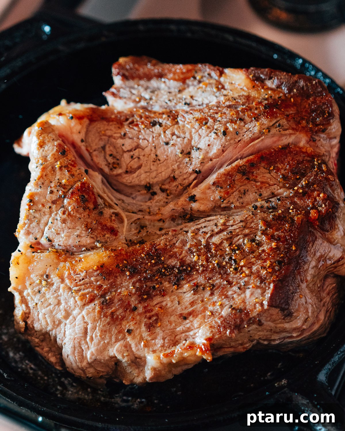 Slow Cooker Chuck Roast Melts in Your Mouth 4 Step 1: Searing the chuck roast in a skillet to build flavor.