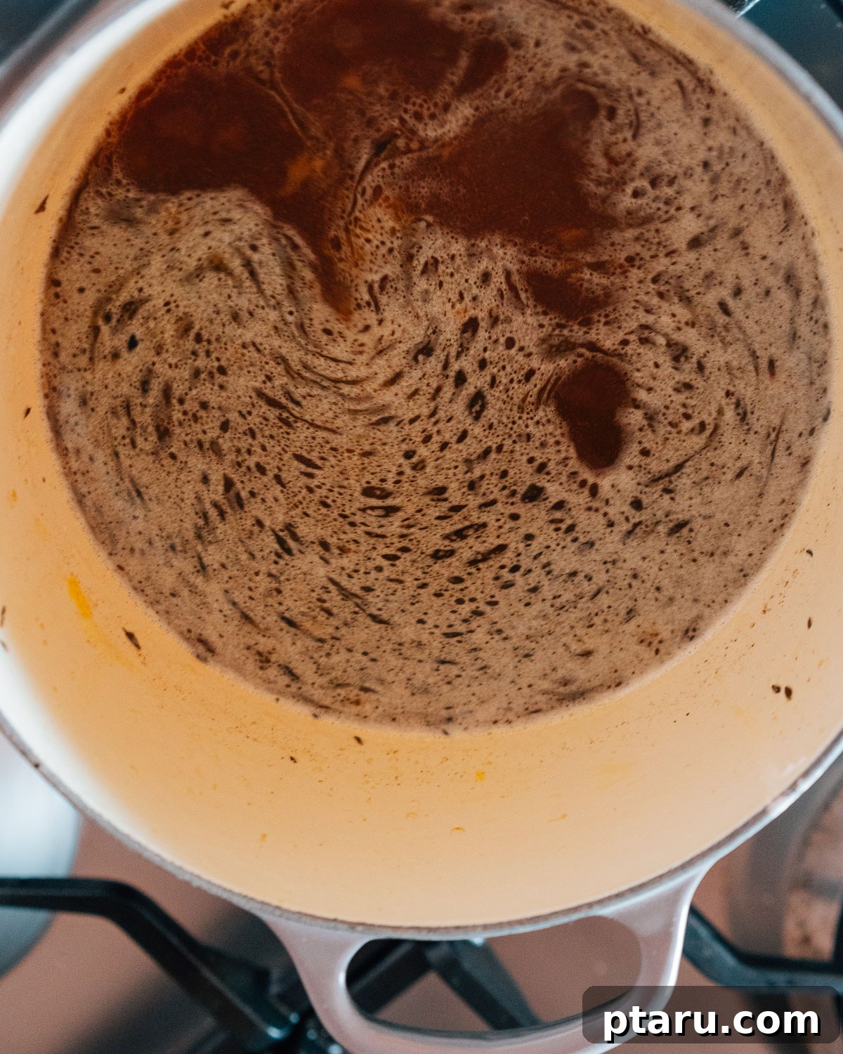 Slow Cooker Chuck Roast Melts in Your Mouth 5 Step 2: Deglazing the pan with red wine after searing the beef.