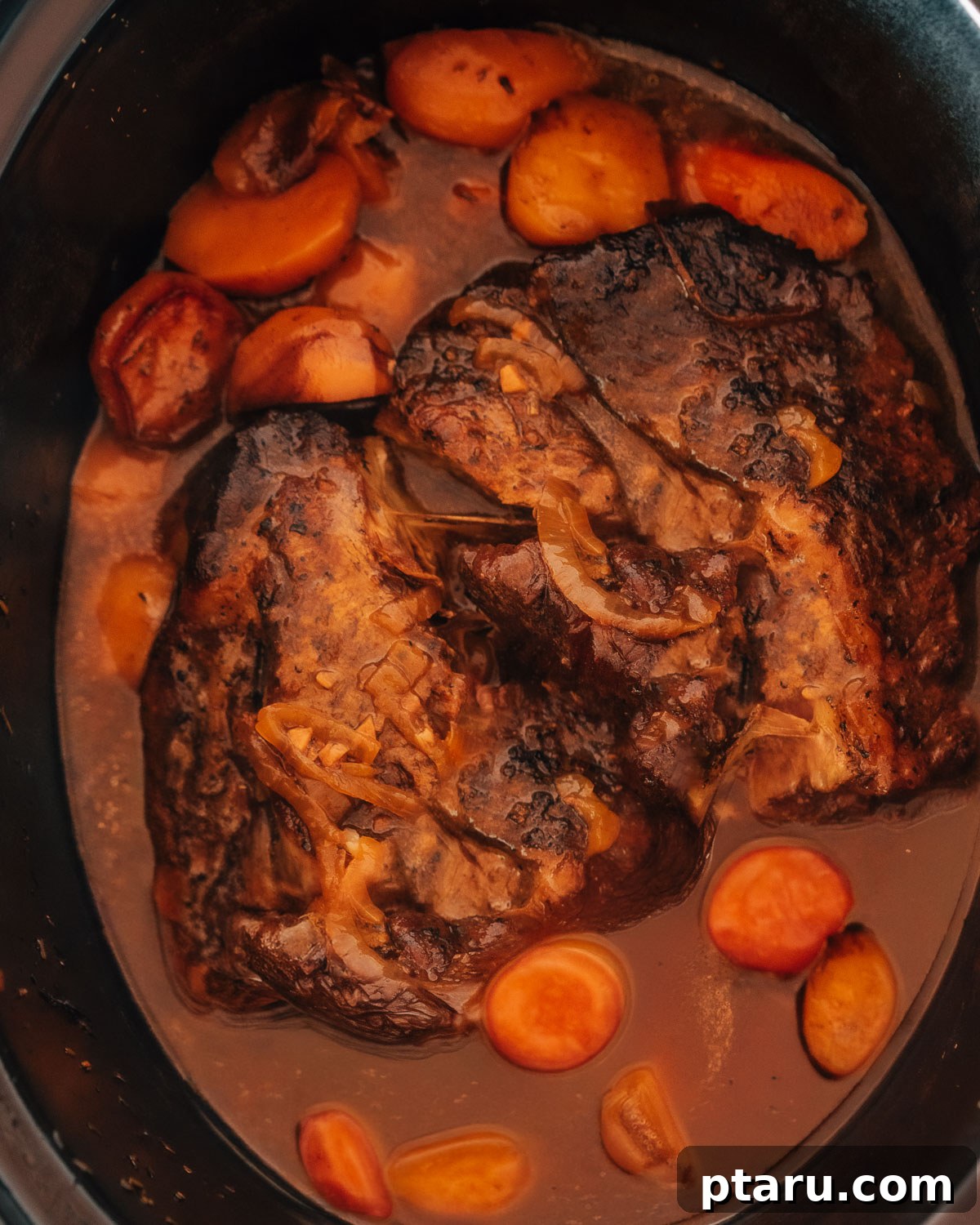 Slow Cooker Chuck Roast Melts in Your Mouth 7 Step 4: The chuck roast cooking in the slow cooker with vegetables.