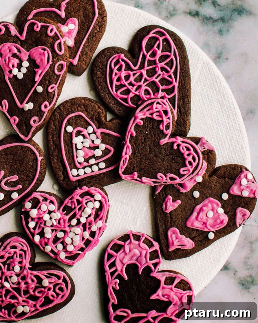 Valentines Sweet Indulgences 2 Heart-shaped chocolate Valentine's cookies on a plate.