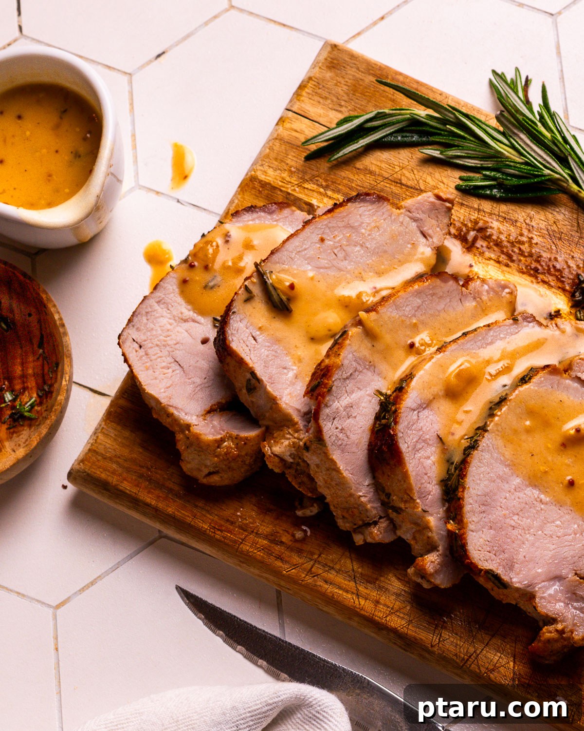 Rich Pork Gravy 2 Rich pork gravy drizzled generously over slices of succulent roast pork loin.