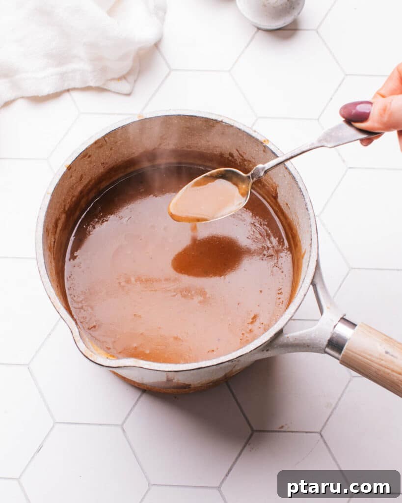 Rich Pork Gravy 9 Final whisking of the rich, savory pork gravy.