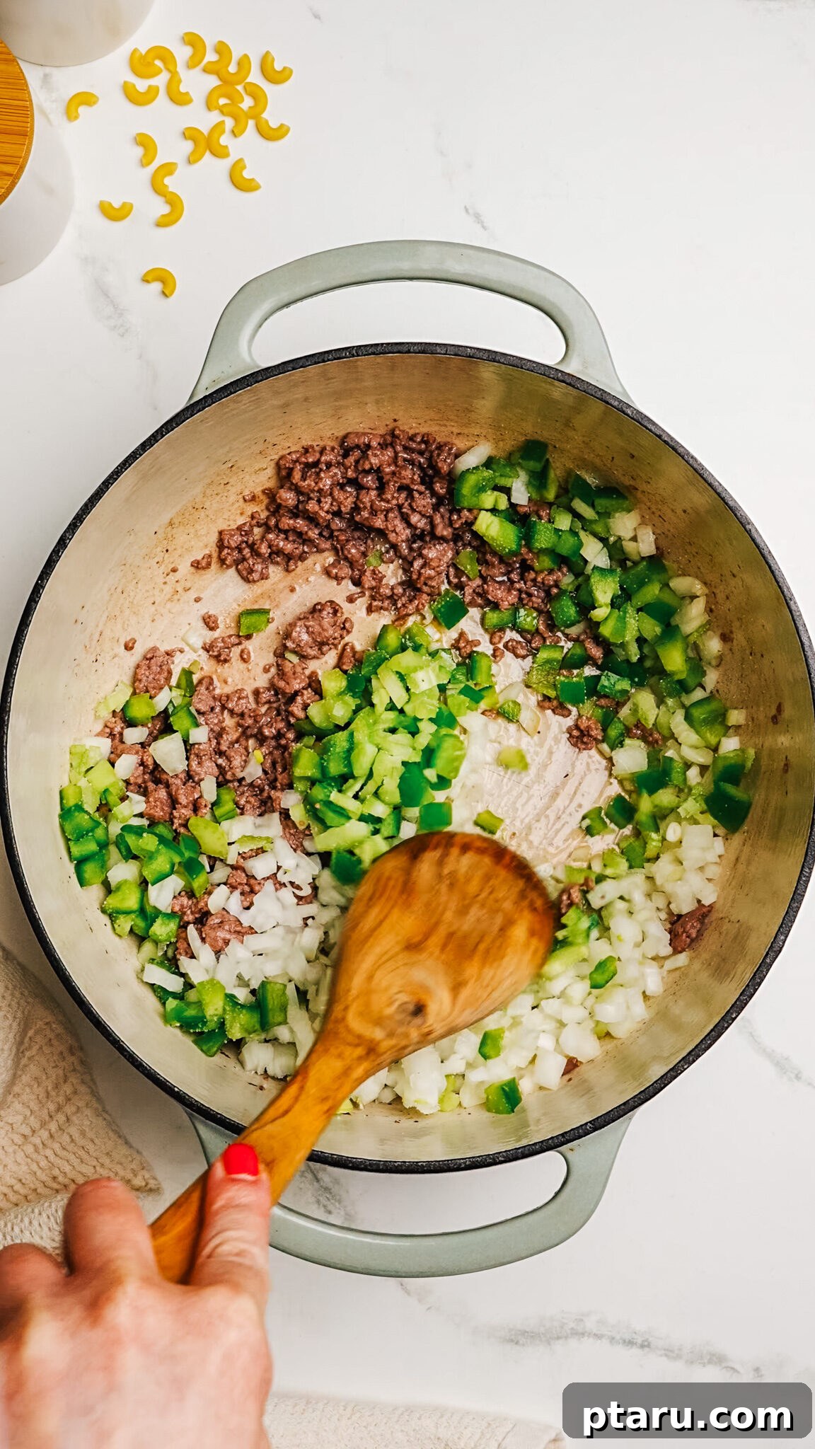 Classic Macaroni Goulash 5 Step 2: Browning ground beef in a Dutch oven with spices.