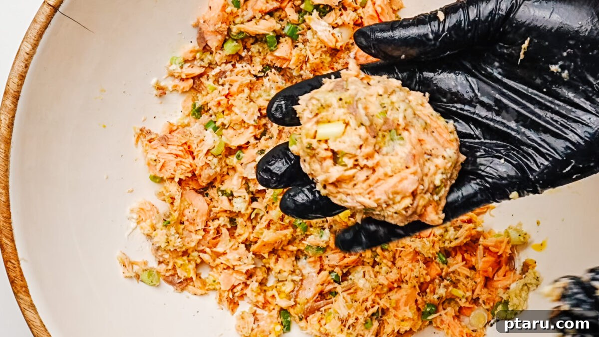 Golden Salmon Fritters 3 Forming salmon patties by hand.