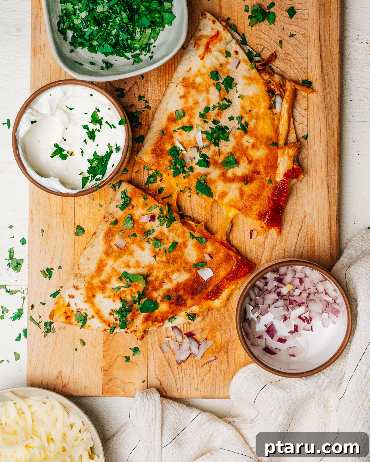 Fiesta Chicken Quesadilla 8 A freshly made, cut chicken quesadilla with melted cheese and seasoned chicken filling, ready to be served.