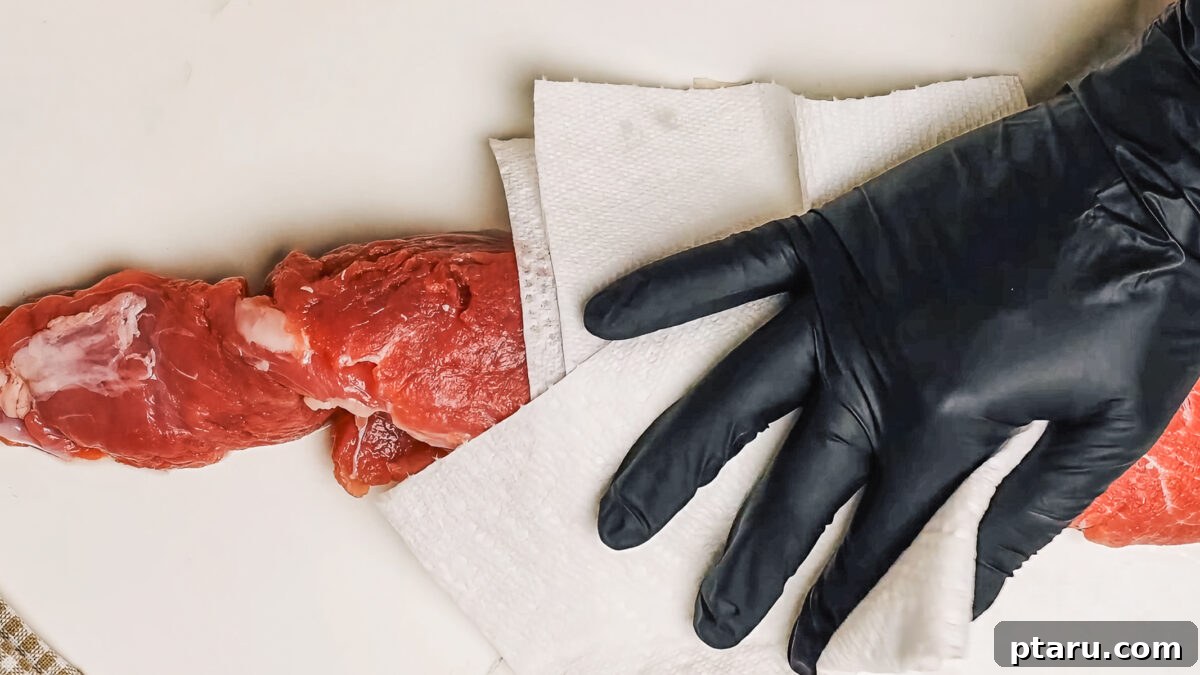 Melt-in-Your-Mouth Pork Tenderloin Recipe 6 Patting Dry Pork Tenderloin with a paper towel.