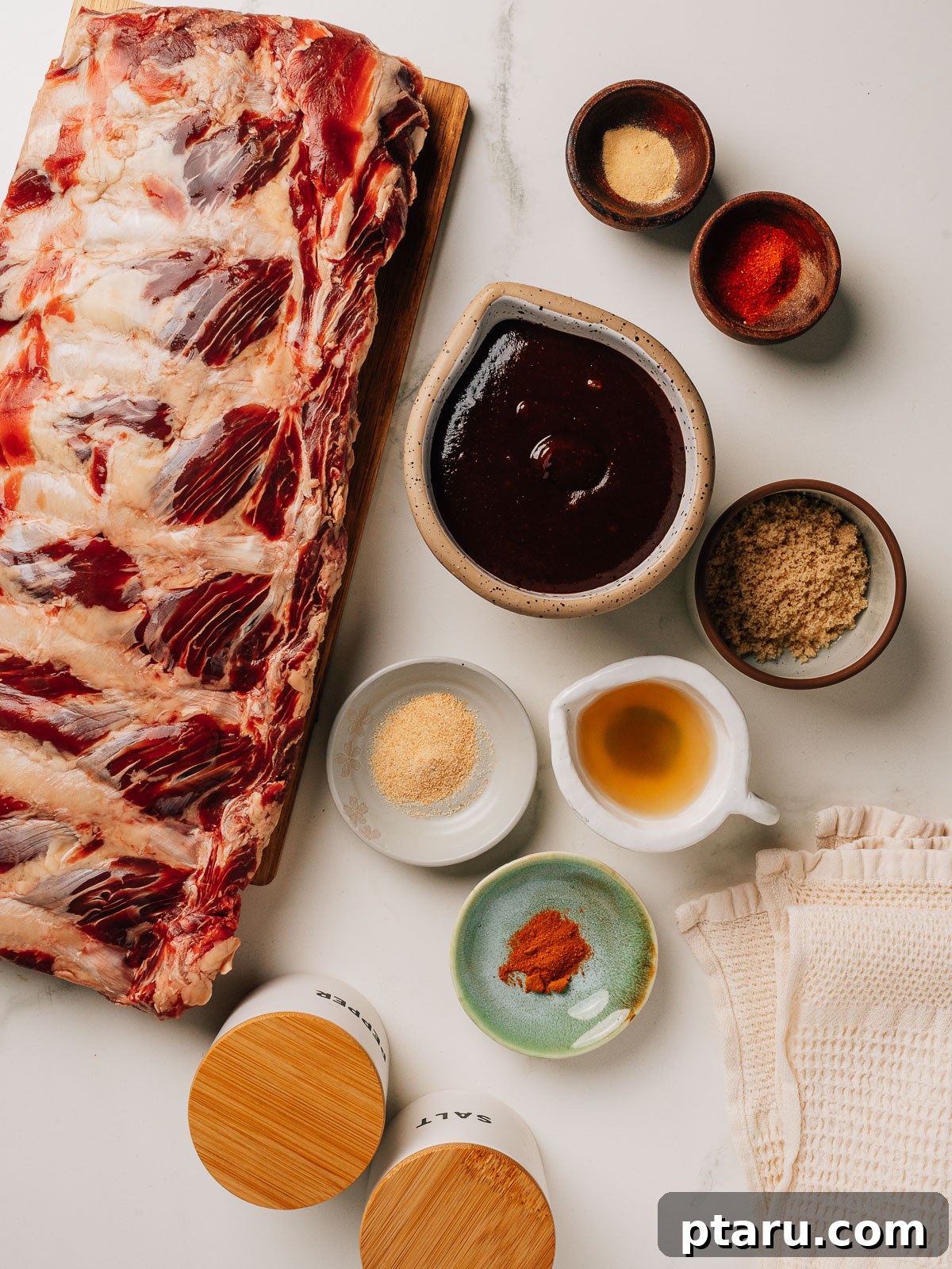 Slow Roasted Tender Beef Ribs 3 All the necessary ingredients for the beef back ribs recipe, neatly laid out on a cutting board.