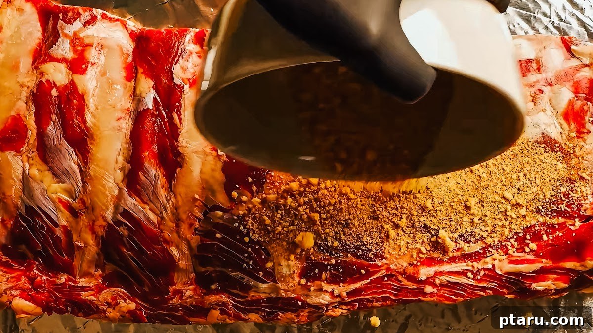 Slow Roasted Tender Beef Ribs 6 Step 2: Applying the dry rub generously to beef back ribs.