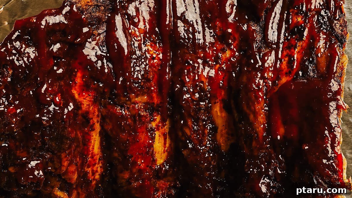 Slow Roasted Tender Beef Ribs 8 Step 4: Broiling beef back ribs with BBQ sauce for a sticky, caramelized finish.