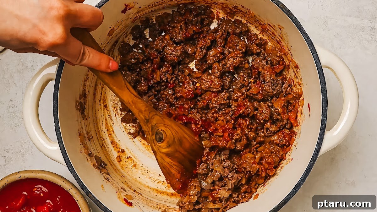 Hearty Beef Spaghetti Made Simple 5 Toasting tomato paste in a pan until darkened for rich spaghetti sauce