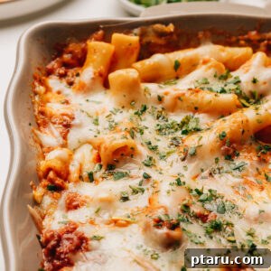 Baked ziti with ricotta topped with minced parsley.