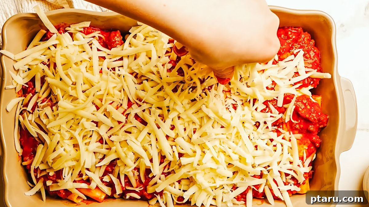Ultimate Ricotta Ziti Bake 8 Meat sauce simmering in the pot