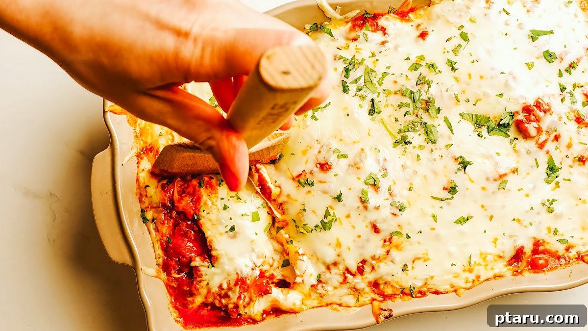 Ultimate Ricotta Ziti Bake 9 Layers of baked ziti in a baking dish