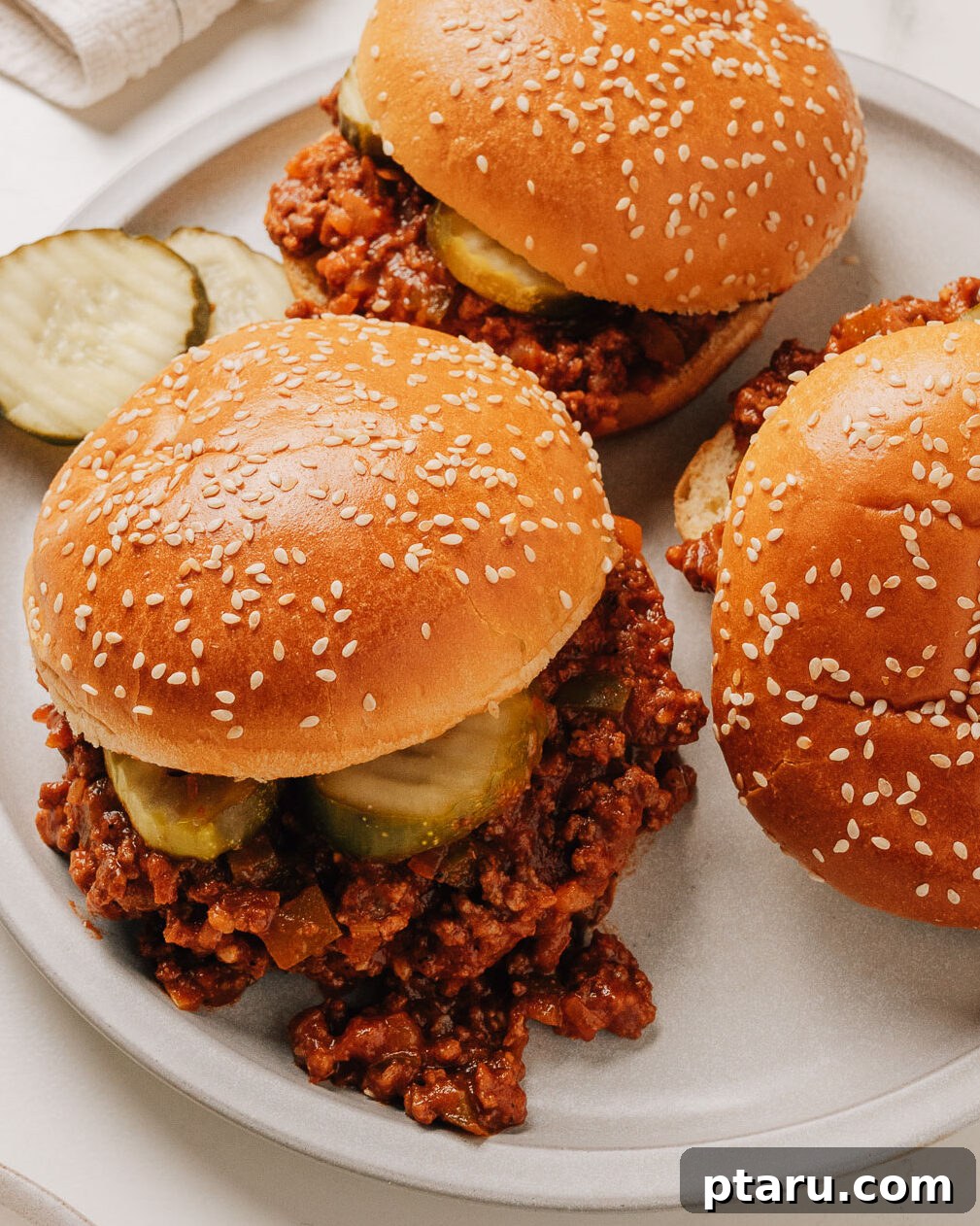 Classic Homemade Sloppy Joes Recipe: Quick Weeknight Sandwich Plan 2 Easy sloppy joes recipe in buns on a plate.
