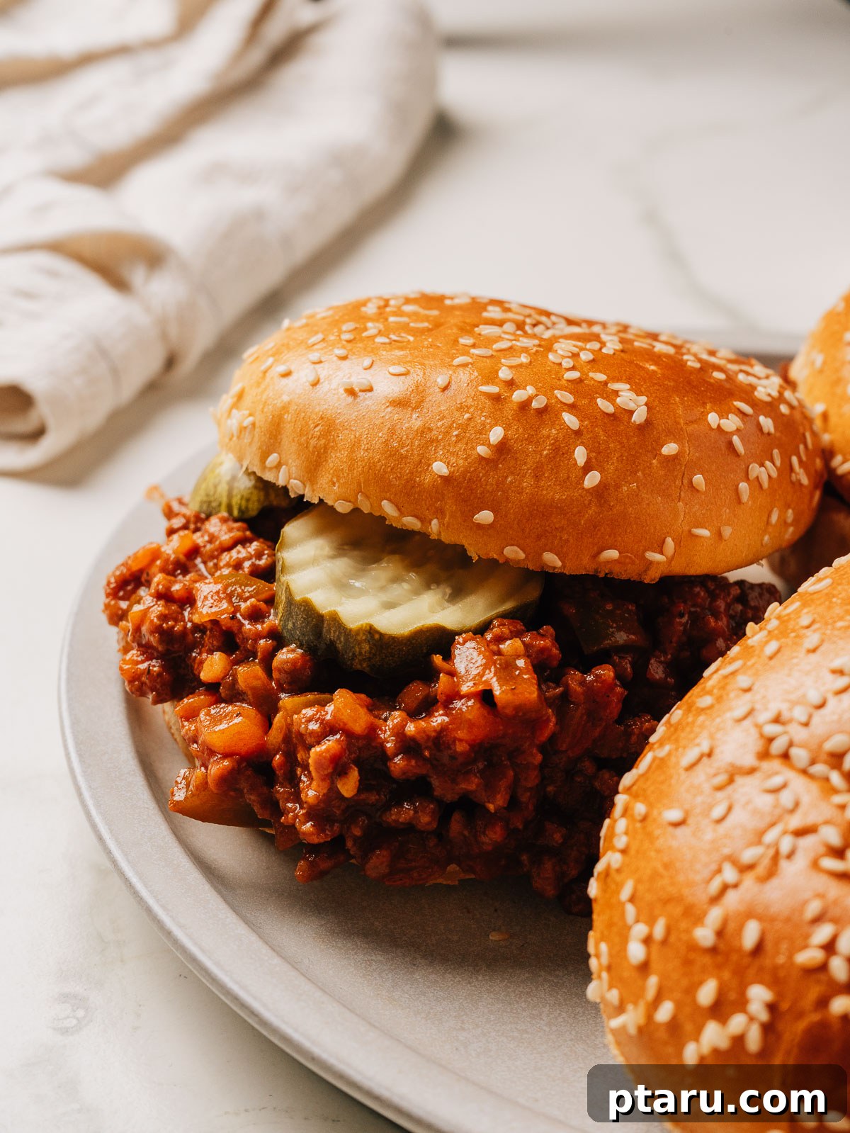Classic Homemade Sloppy Joes Recipe: Quick Weeknight Sandwich Plan 4 Easy sloppy joes recipe in a bun on a plate.