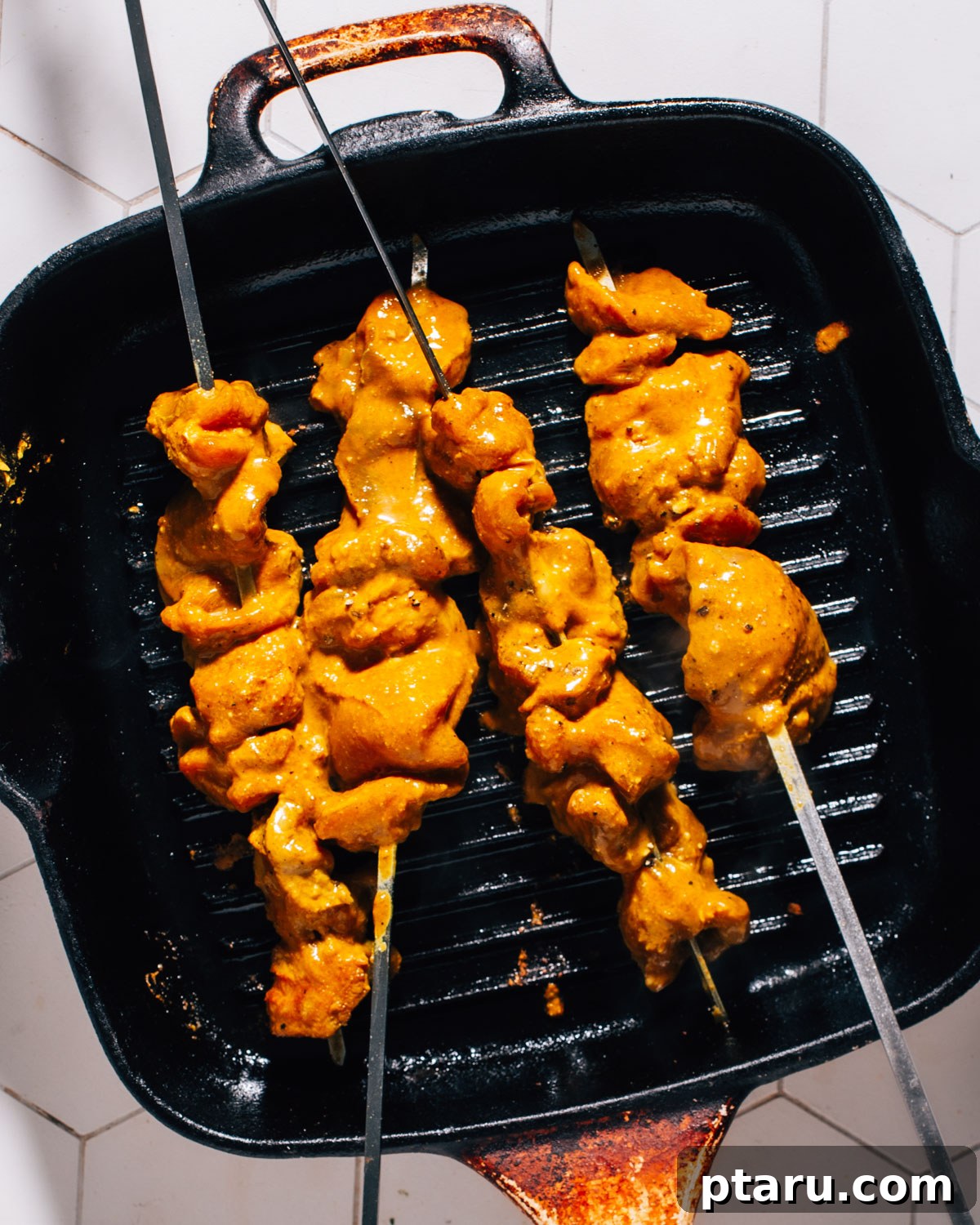 Juicy Turkey Tikka with Cooling Cucumber Raita 5 Cooking chicken kebabs.