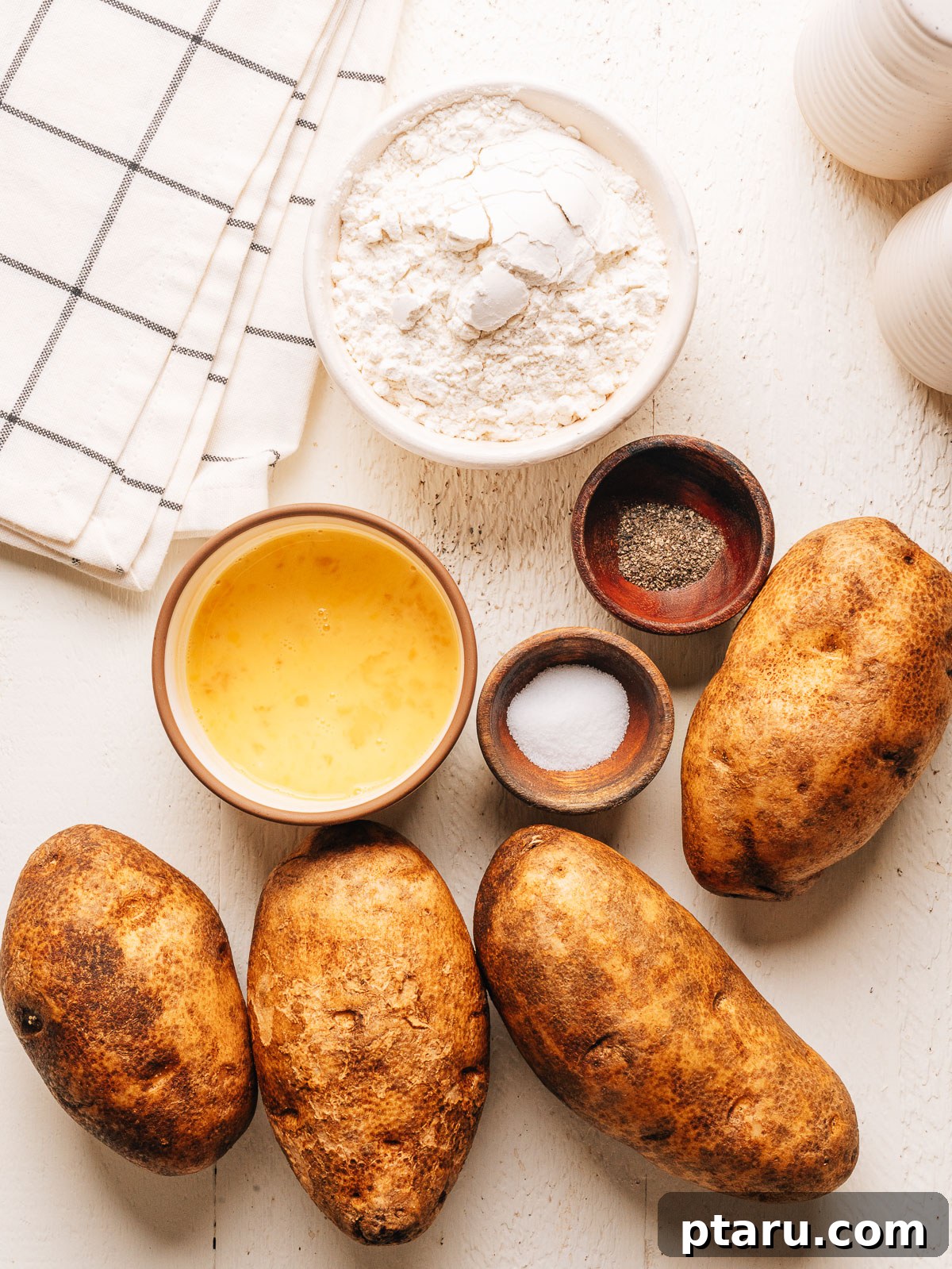 Russet potatoes, flour, eggs, salt and pepper for homemade potato gnocchi.
