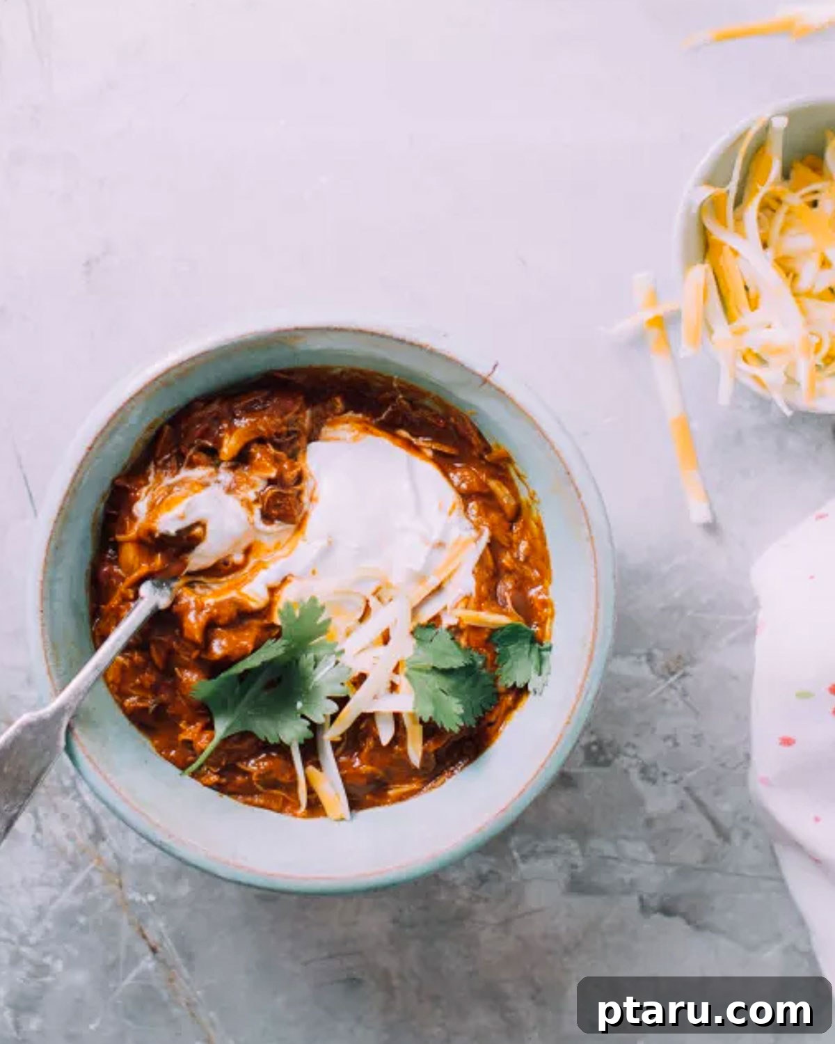 30 One-Pan Chicken Dinners: A Month of Simple Recipes 25 Instant Pot chicken chili topped with cheese.