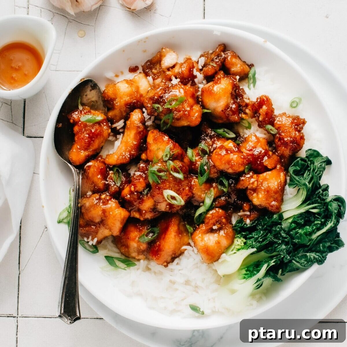30 One-Pan Chicken Dinners: A Month of Simple Recipes 5 Honey garlic chicken pieces with a sticky glaze.