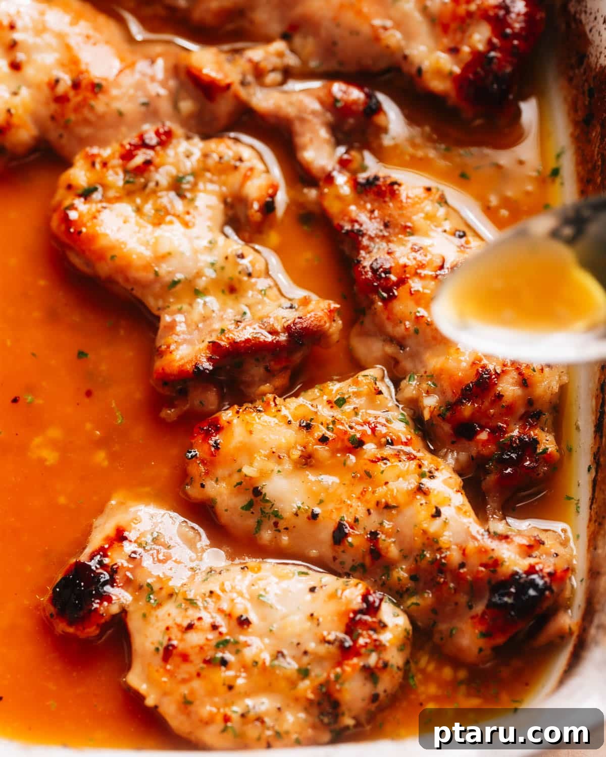 30 One-Pan Chicken Dinners: A Month of Simple Recipes 7 Honey garlic lemon pepper chicken thighs in a baking dish.