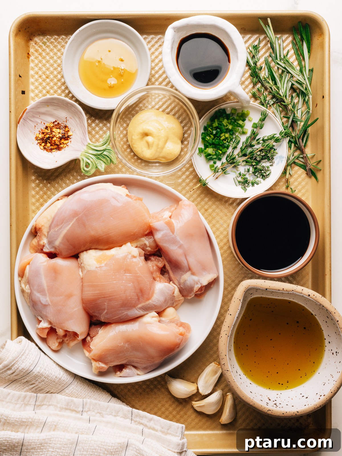 Ingredients for balsamic chicken marinade recipe on a sheet pan. 