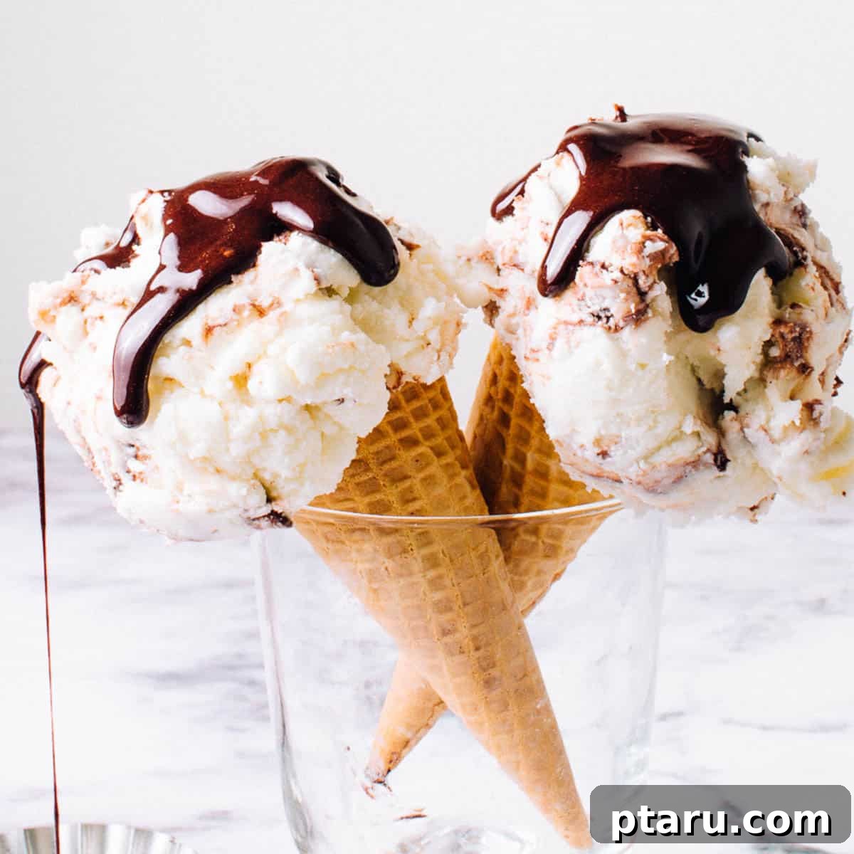 18+ Homemade Frozen Treats: Popsicle and Ice Cream Recipes 22 Homemade hot fudge sauce poured over ice cream.
