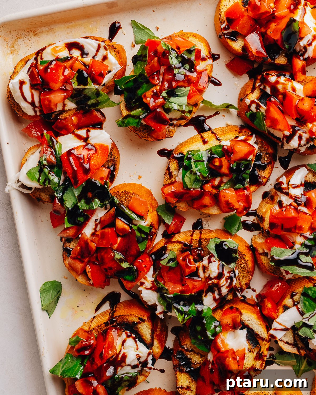 Fresh Mozzarella Bruschetta: Classic Tomato Appetizer 2 Overhead tray of bruschetta with mozzarella, tomato and basil.
