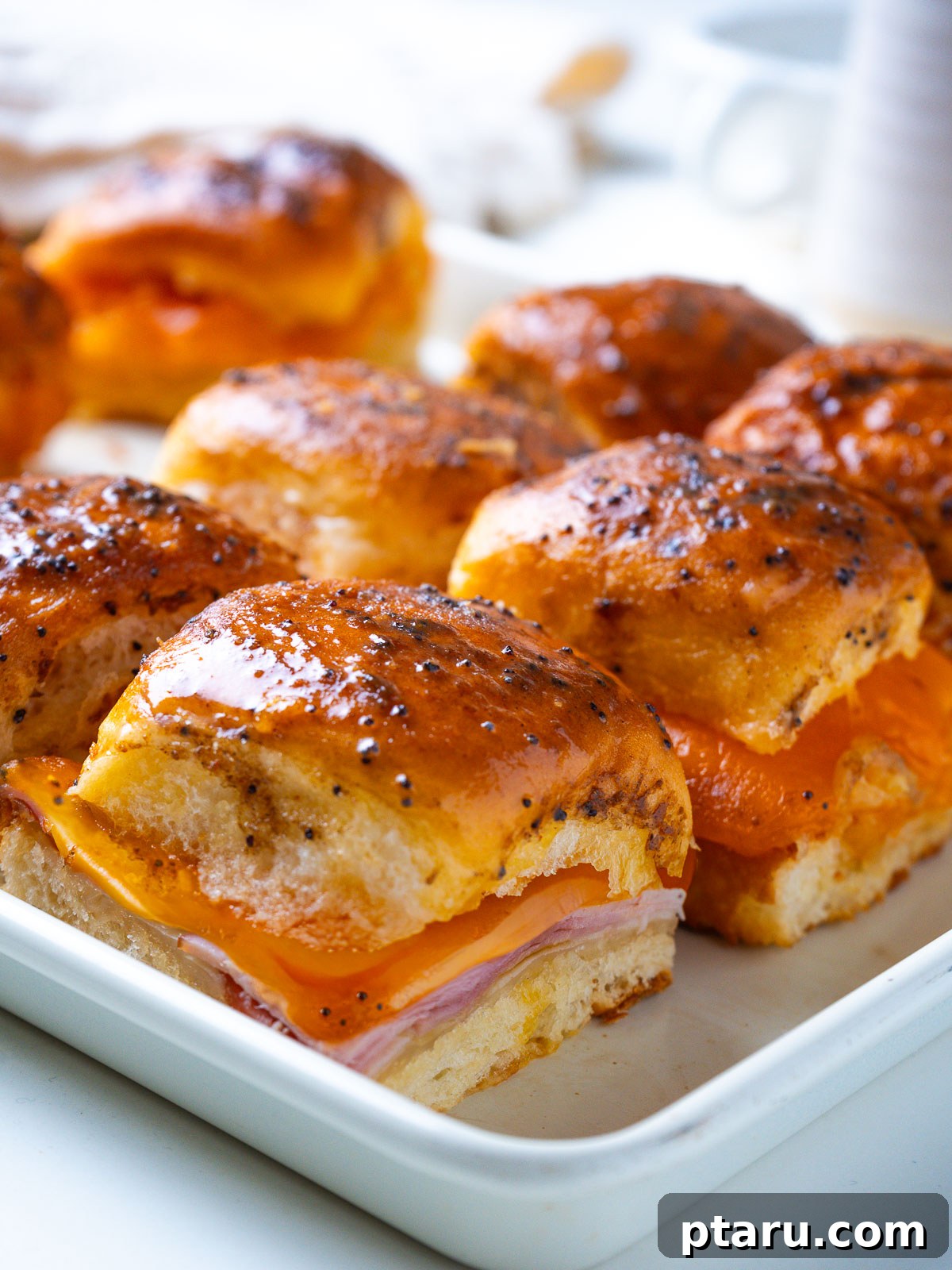 4th of July Appetizer Ideas for Patriotic Gatherings 16 Ham and cheese sliders with a buttery honey glaze.