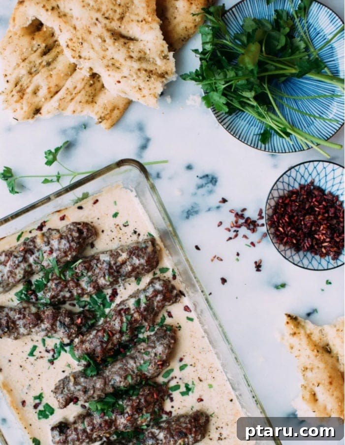Lamb kofta skewers served with tahini sauce.