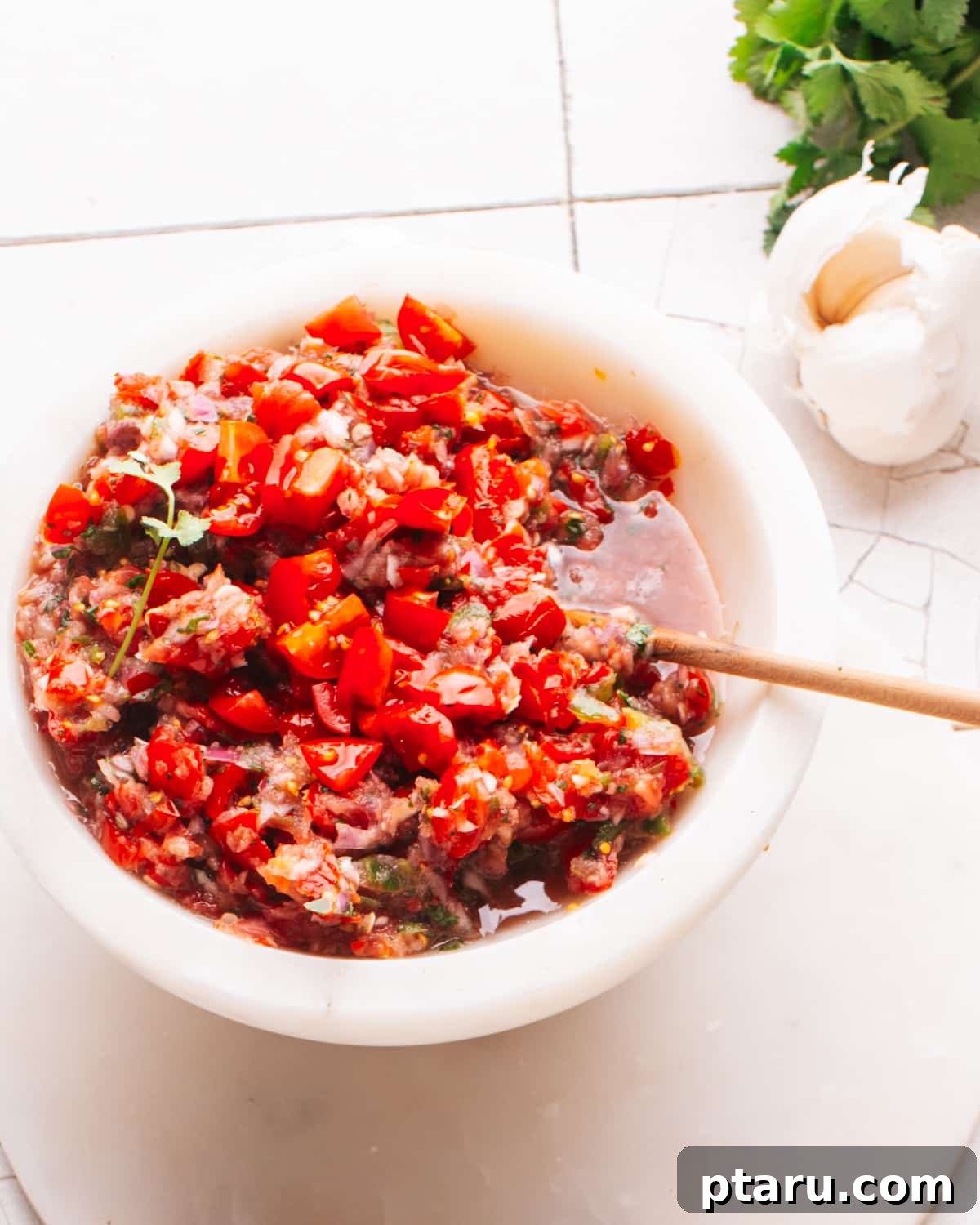Taco salsa in a white bowl, an easy cookout appetizer.