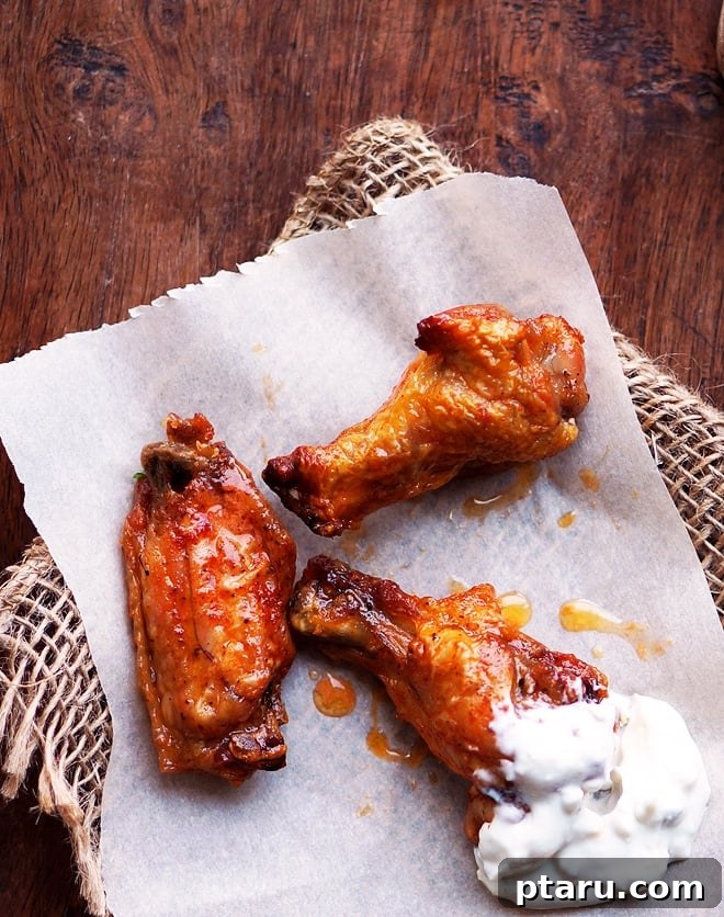 Baked buffalo wings with blue cheese dressing and celery.