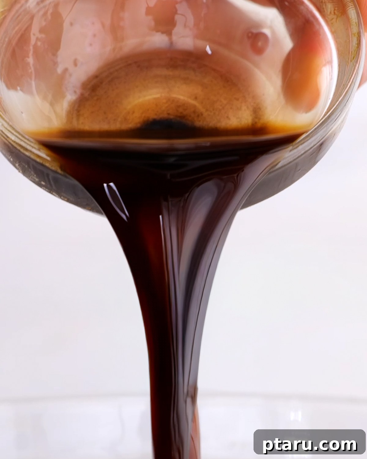 Homemade Balsamic Vinaigrette Recipe 7 Homemade balsamic vinaigrette dressing being poured out.
