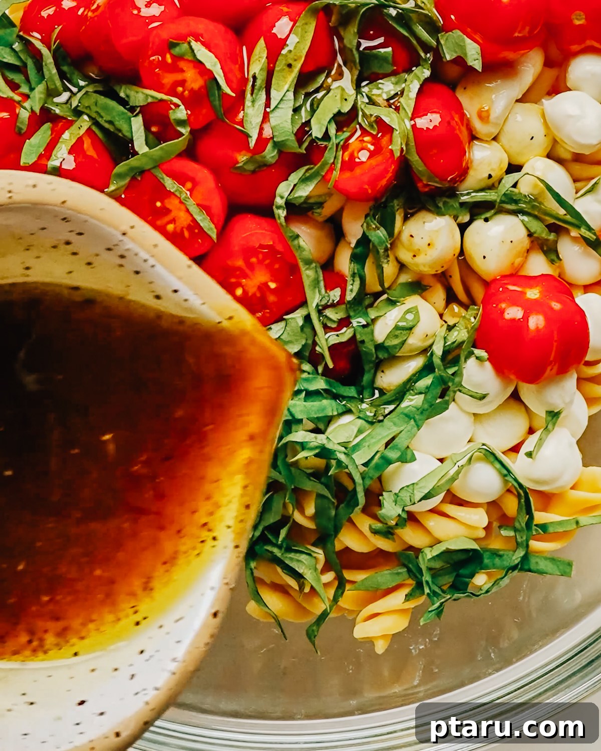 Homemade Balsamic Vinaigrette Recipe 8 Homemade balsamic vinaigrette dressing being poured out.